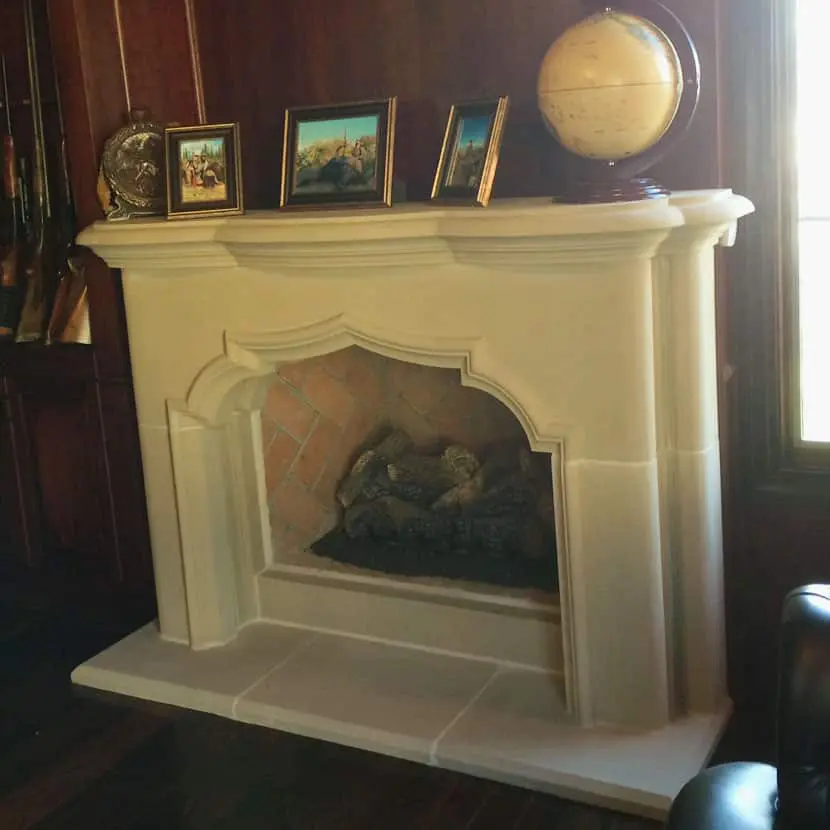 Detailed image of the Avalon cast stone fireplace mantel.