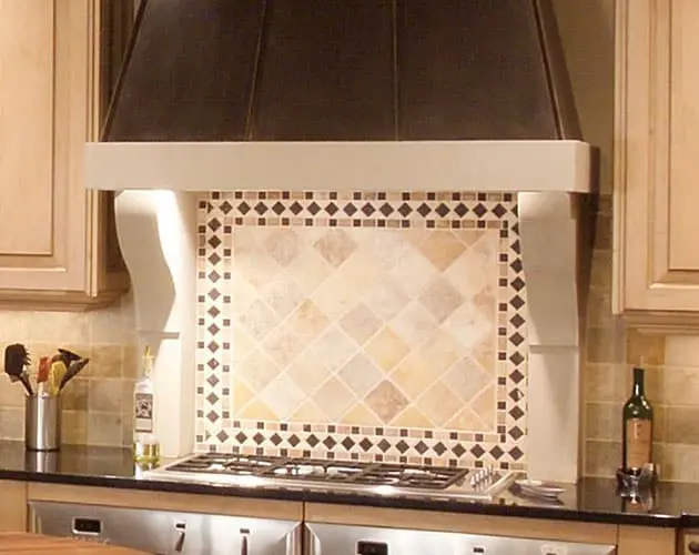 Modern cast stone kitchen range hood in a contemporary kitchen.