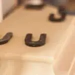 Intricate cast stone fireplace mantel installation in luxury home