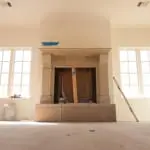 Detailed installation of Old World Stoneworks cast stone mantel