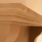 Custom home installation of Old World Stoneworks cast stone mantel