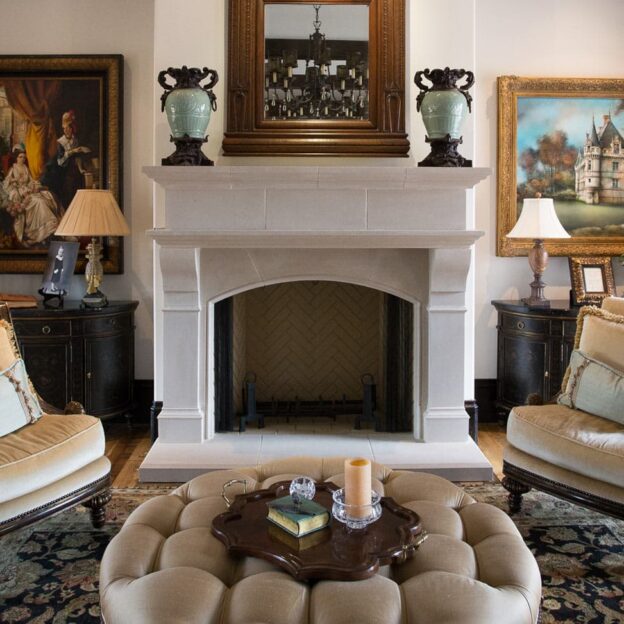 Detailed image of Normandy cast stone fireplace mantel.