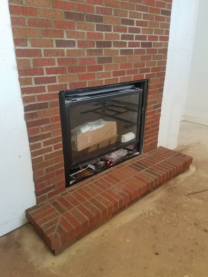 Brunswick cast stone fireplace mantel before installation in a customer's living room.