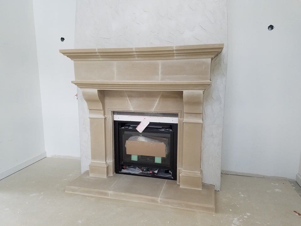 Brunswick cast stone fireplace mantel design.