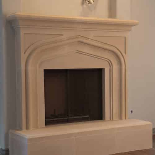 Custom Laurent cast stone fireplace mantel.