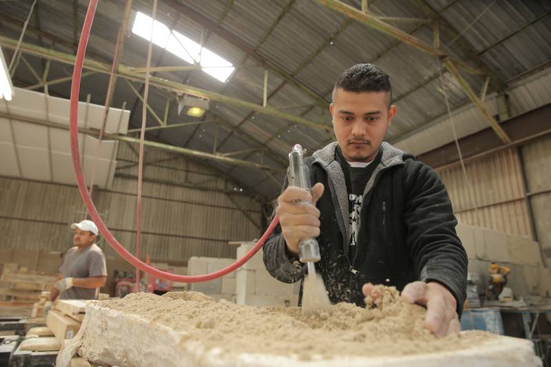 Pneumatic hammers force the mixture into the mold