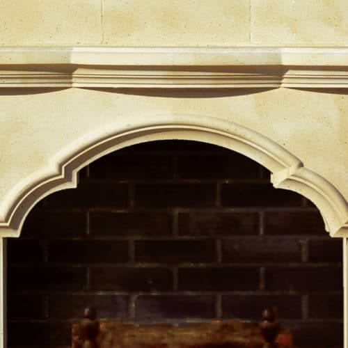 Avondale cast stone fireplace mantel center detail.