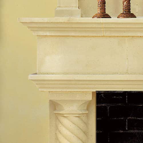 Cordova-A cast stone fireplace mantel left upper corner detail.
