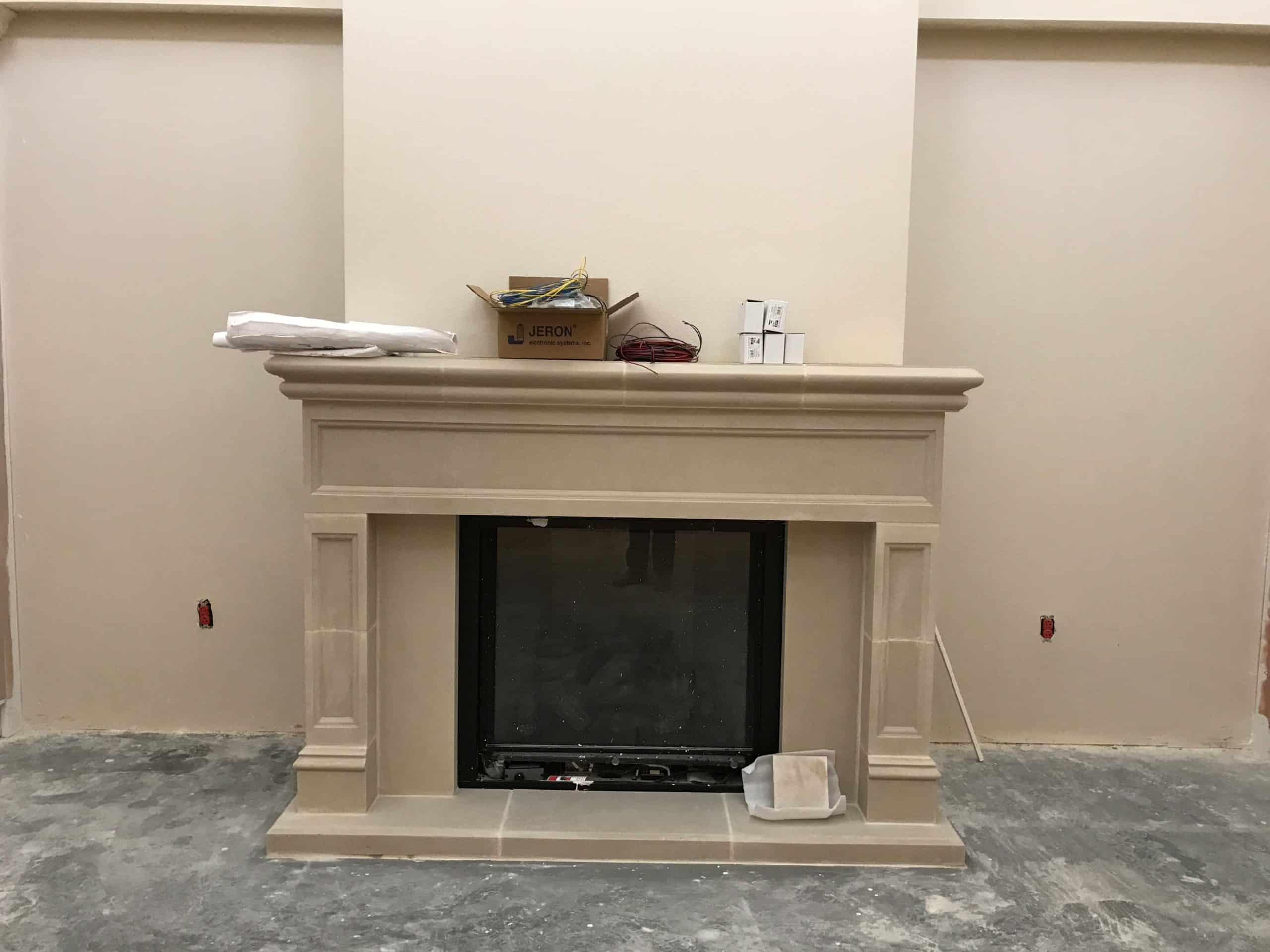 Custom Devon fireplace mantel during installation.