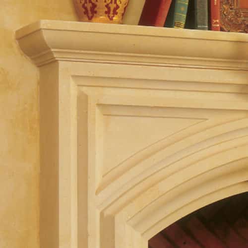Fremont cast stone fireplace mantel left upper corner detail.