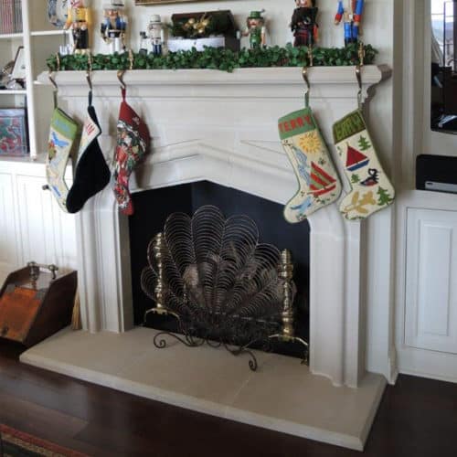 Laurent cast stone fireplace mantel in a home setting.