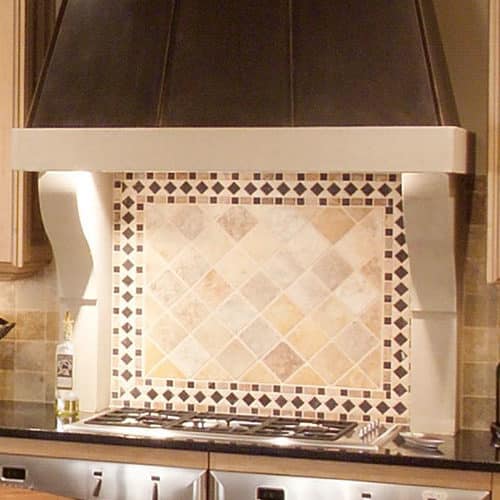Modern cast stone kitchen range hood in a contemporary kitchen.