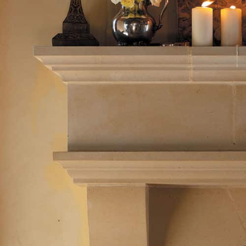 Normandy Living Room cast stone fireplace mantel upper left corner detail