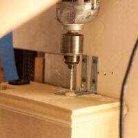 Old World Stoneworks cast stone mantel installation corner detail