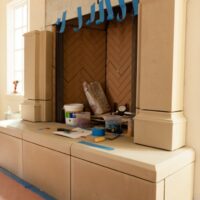 Old World Stoneworks cast stone overmantel installation