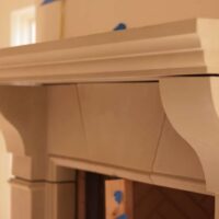 Montgomery model cast stone fireplace mantel by Old World Stoneworks