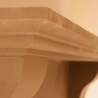 Custom home installation of Old World Stoneworks cast stone mantel