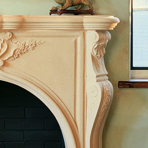 Taunton cast stone fireplace mantel right upper corner detail.